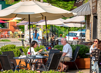 people sitting outside at a table
