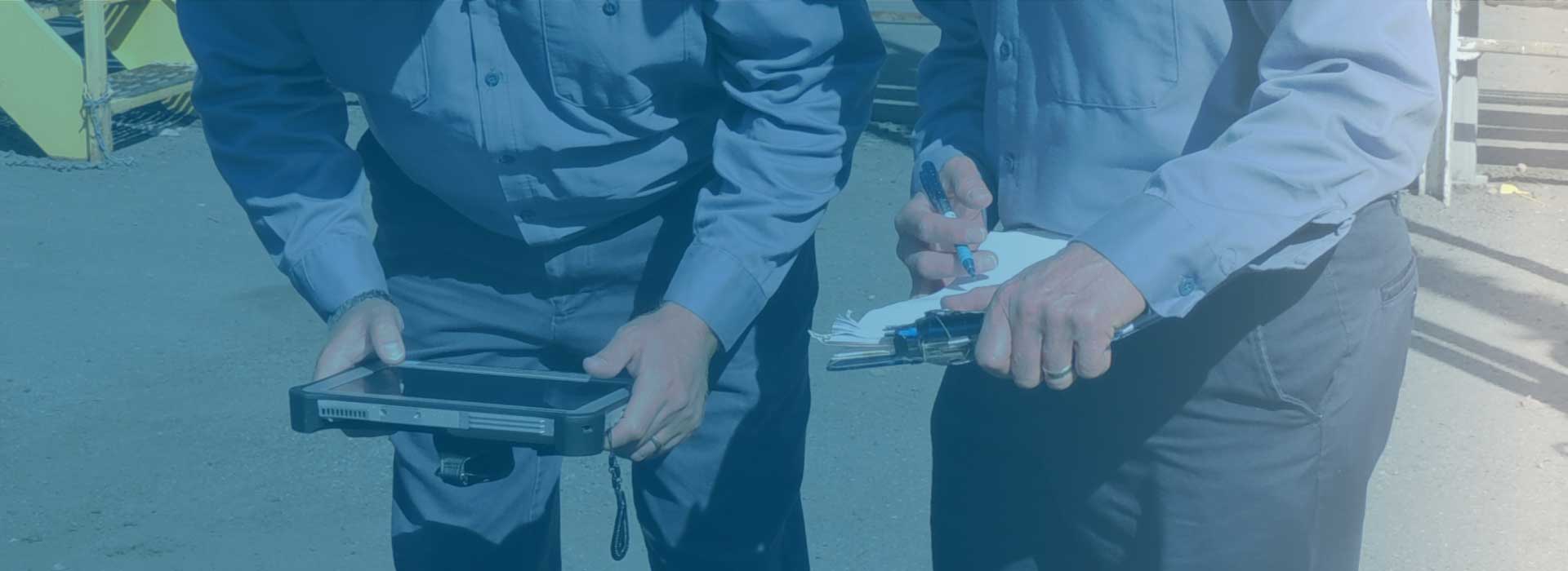 Two employees comparing notes