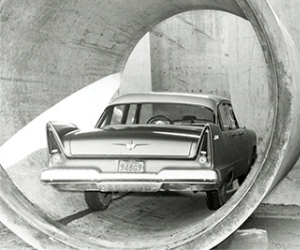 car in a sewer pipe