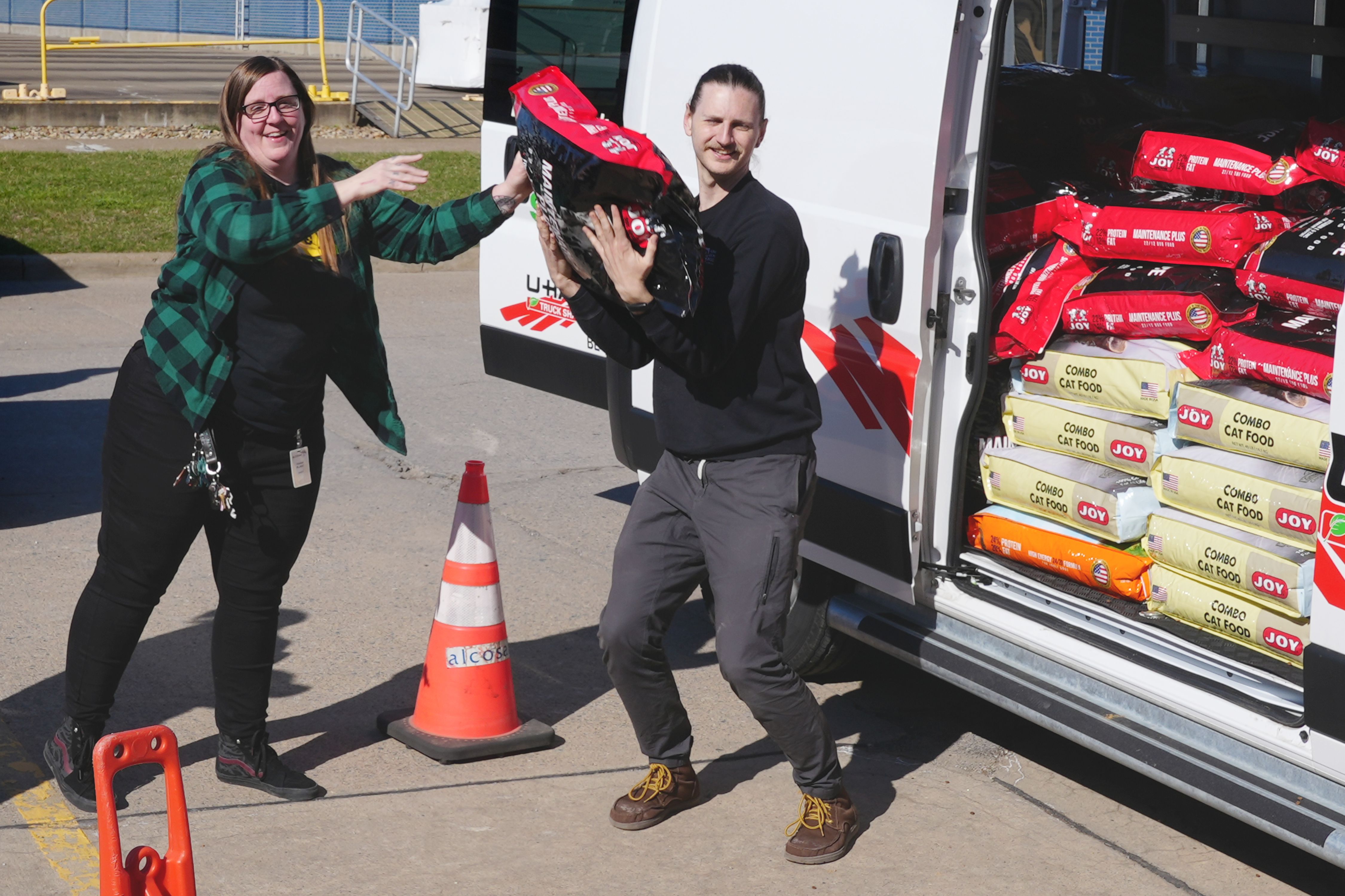 Donations being loaded into Humane Animal Rescue vans