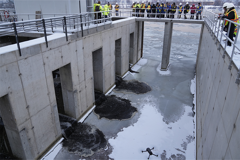 ALCOSAN employees looking at effluent on ice