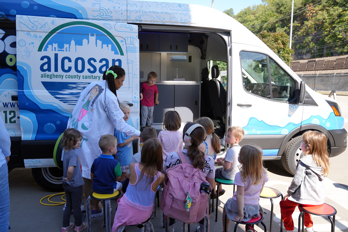 Students exploring Frankie’s Science on the Go mobile classroom